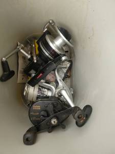 waste basket with fishing reels and a new pack of 60 lures