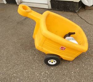 kids pull behind wagon - yellow plastic
