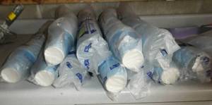 Eleven packages of 100 solo cups