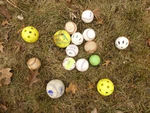 group of baseballs, wiffle balls