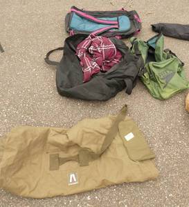 3 duffle bags and backpack