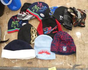 Lot of kids stocking hats all like new and hockey shorts