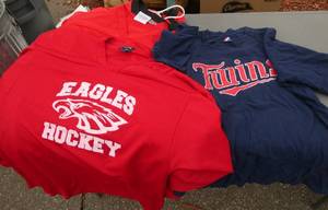 Group of hockey jerseys and twins shirt