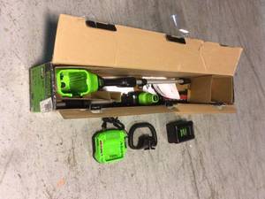 lot 89 image: Greenworks PRO 20 in. 60V Battery Cordless Pole Hedge Trimmer with 2.0 Ah Battery and Charger Customer Returns See Pictures
