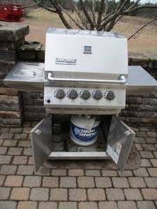 Ducane Stainless Propane Gas Grill with separate burner, rotisserie, motor, full propane tank.
