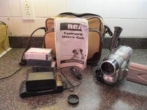 Lot of Video Camcorders with cases, manuals, and parts