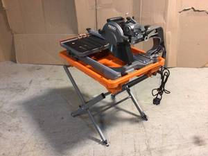 9 Amp Corded 7 in. Wet Tile Saw with Stand by RIDGID Customer Returns See Pictures