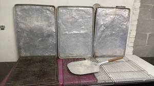 lot 305 image: Bakery Bundle- Three 18 x 25.5 Aluminum Bakery Cookie Sheets, 26 Pizza Peel, 6 x 24.5 Oven Racks