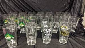 lot 299 image: 25 Assorted 16 Oz Beer Glasses-  Widmer Brewing Co., Descutes Brewery, Summit Brewing Co., Fulton, Third Street Brewhouse, Curious Traveler  Shandy