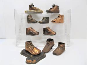 lot 15 image: Group of Antique Bronzed Baby Shoes