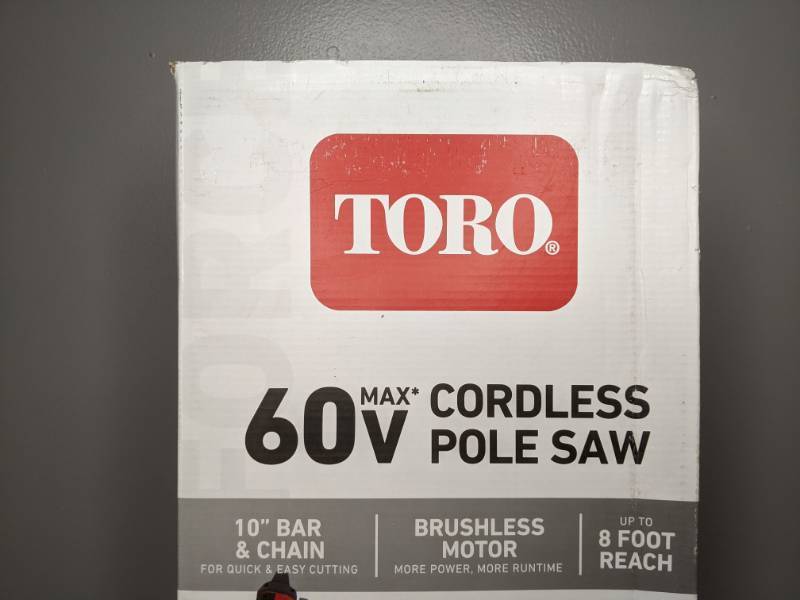 lot 47 image: Brand New Toro 10 in. 60-Volt Lithium Ion Cordless Electric Pole Saw Battery and Charger Included - T
