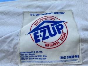 lot 351 image: E-Z Up Instant Shelter Original Shade 10x10 with (12) Refillable Sandbags - Z