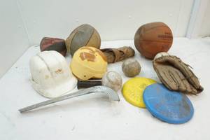 lot 87 image: basketballs, gloves, helmuts and frisbees