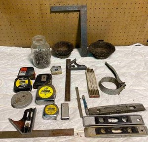 lot 107 image: Lot of Measuring Tapes, Levels, Nails and More