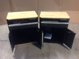 Lot of 2 Ready-to-Assemble 24-Gauge Steel 1-Drawer 2-Door Garage Base Cabinet in Black (28 in. W x 33 in. H x 18 in. D) by Husky Customer Returns See Pictures