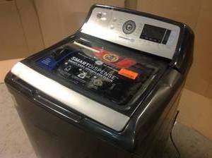 5.2 cu. ft. High-Efficiency Smart Diamond Gray Top Load Washer with Smart Dispense and Sanitize with Oxi, ENERGY STAR by GE Missing Push Button Customer Returns See Pictures
