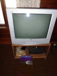 27 RCA TV. Tested & works. Includes cabinet & vhs player. As shown.