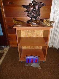 Wood 2 shelf cabinet with bronze bird statue & brass butterfly. As shown.