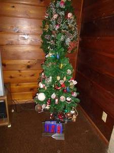 Qty of 2 Christmas tress. 1 free standing & 1 is wall mount. As shown.