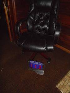 Black office chair. Looks like leather. Nice condition. As shown.