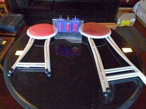 Qty of 2 folding stools. 1 low & 1 high. As shown.