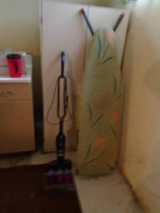 Ironing board vacuum & storage cabinet. As shown.