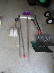 Assorted odd shovels & roof rake. As shown.