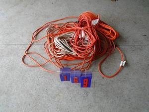 Misc pile of extension cords. 1 looks new. As shown.
