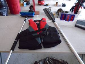 Sterns XL life jacket with paddle & boat brush. As shown.