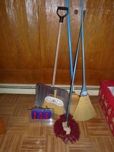 Assorted brooms & shovels. As shown.