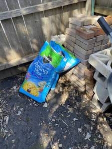 Wheel Barrow, Bricks, & Potting Mix
