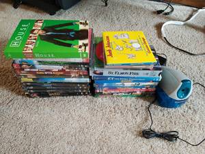 Collection of DVDs and a Pencil Sharpener