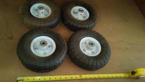 lot 42 image: (4) 10 in. Pneumatic Tires, Complete