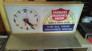 lot 199 image: Farmers Ins. Lighted Clock, powers up, 25 x 12 x 3 in.