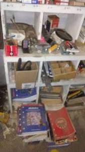lot 210 image: Contents of Cubbies, Spark Plugs, Manuals and more