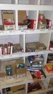 lot 211 image: Contents of Cubbies, Spark Plugs, Manuals and more
