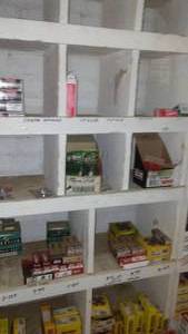 lot 213 image: Contents of Cubbies, Spark Plugs, Manuals, U Joints and more