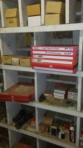 lot 220 image: Contents of Cubbies, Floats, gaskets, Bushings, Stud Nuts, and more