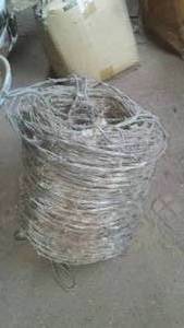 lot 573 image: Spool of Barbed Wire. Loc G