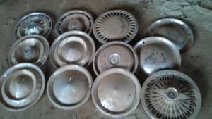 lot 574 image: 12 Misc. Hub Caps. Mostly Chevrolet.  Loc G