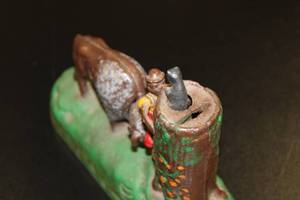 lot 22 image: Vintage Cast Iron Mechanical Bank Buffalo Tree Stump Repo from The Book of Knowledge
