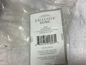 lot 28 image: Winter White Woven Thermal Blackout Curtain - 52 in. W x 84 in. L (Set of 2) Customer Returns See Pictures