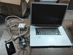 Old Apple Mac Book Pro-No Charger, Old Apple Apple Phone-No Charger, Other Apple Charger, Sansa C-150. All Of Unknown Working Condition