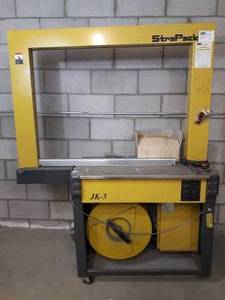 lot 12 image: WOW MSRP $6000 Strapack JK-5 Mobile Box Crate Or Package Strapping Machine Ideal for ShippersFirst Class MailersSmall-to Medium-size Manufacturers - Comes WManual & Tools Needs 2 Wheels Replaced - Great Working Condition