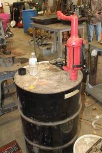 lot 102 image: 55-Gallon Metal Drum  Hand Pump