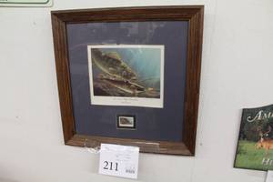 lot 211 image: International Eelpout Stamp Print by James A. Meger circa 1988 Signed Print w Leech Lake Stamp , Wood FrameSingle Matte
