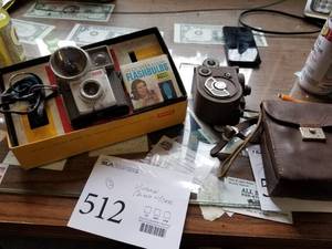 lot 512 image: Vintage Kodak Brownie Starmite Camera with Flash and Bulbs (in box), The Revere Model 88 Double 8 8mm Camera with Case