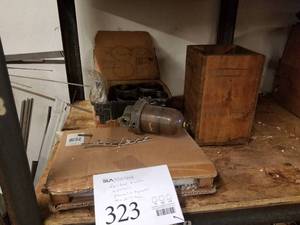 lot 323 image: Ford Fairlane Emblem, (4)  Pistons, Fuel Tank, Pneumatic Separator, Misc. Parts