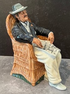 lot 22 image: Royal Doulton - Taking it Easy Figurine