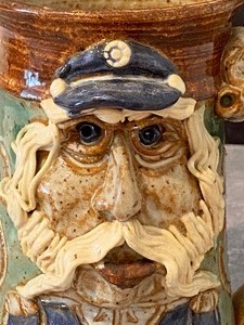 lot 50 image: Caricature Pottery Mug - Jim Coiner Pottery